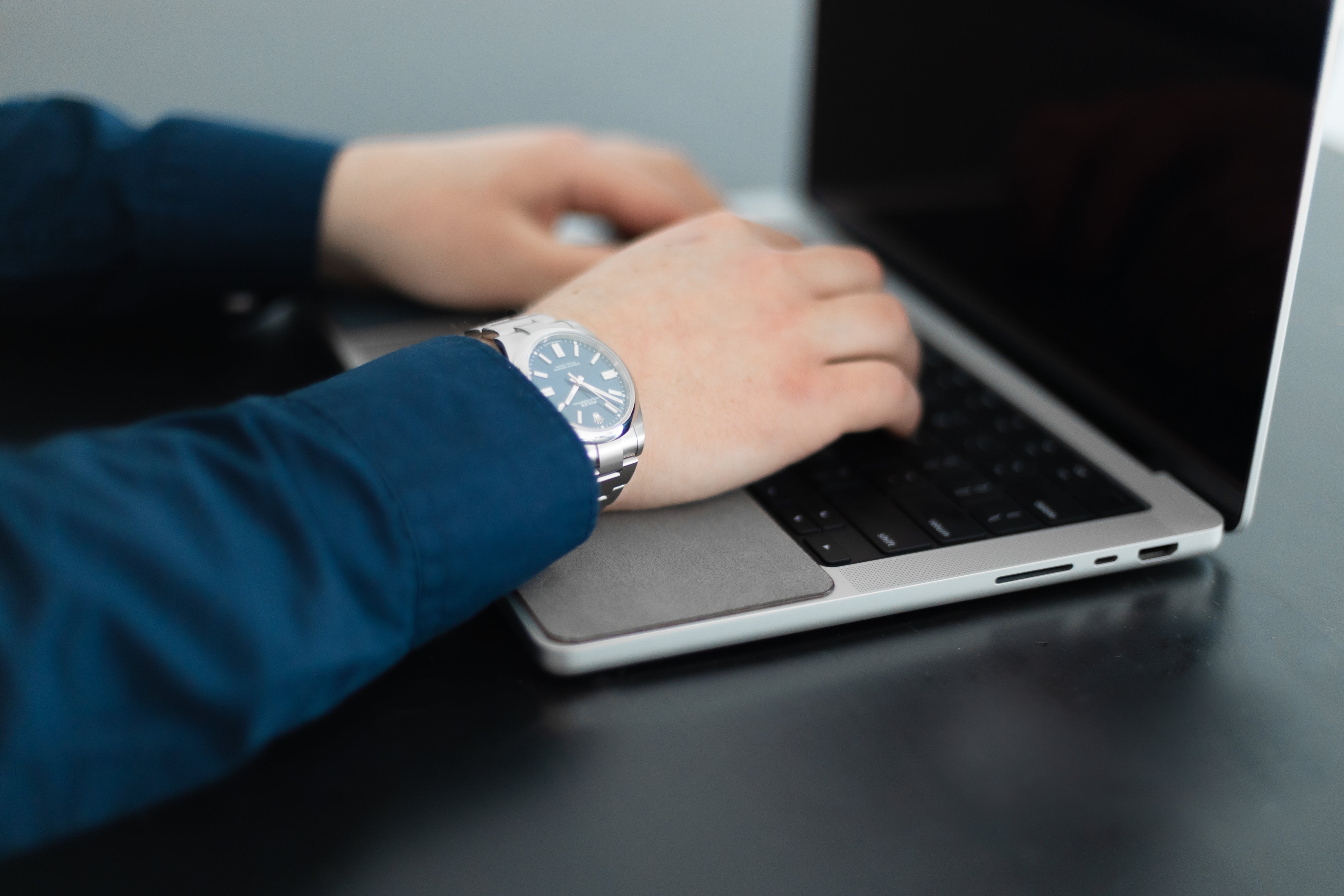 19th& WatchPad in use, showing its placement near the laptop's trackpad